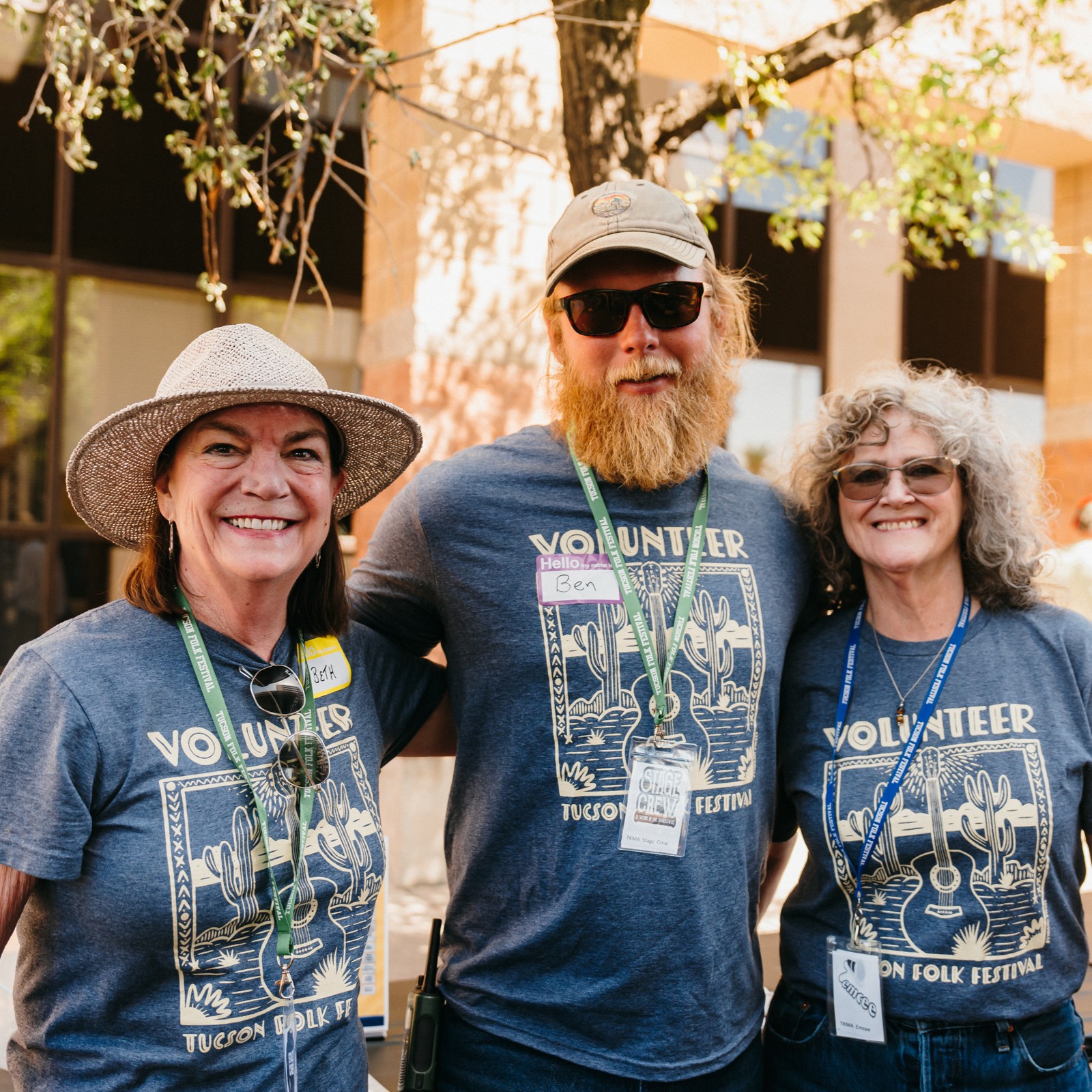 photo of three smiling volunteers